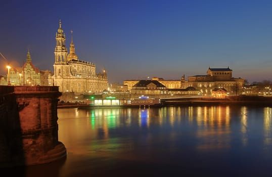 View from the Augustus Bridge to the old town silhouette of Dresden at dusk