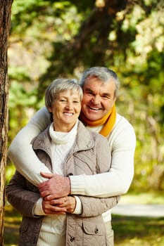 Photo of senior couple in autumn forest
