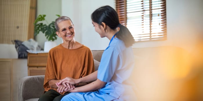 Empathy, trust and nurse caregiver holding hands with patient. consulting support and healthcare advice. Kindness, counseling and medical therapy in nursing home for hope, consultation and psychology.