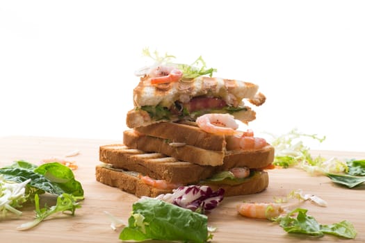 sandwich with lettuce and shrimp isolated on a white background.