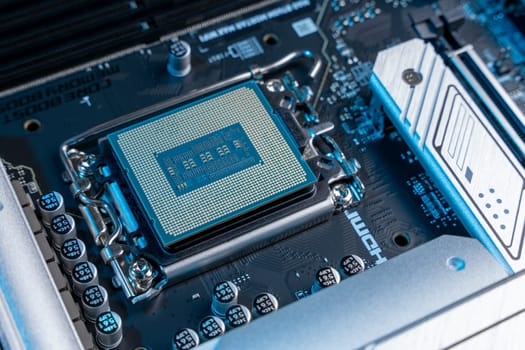 the processor in the motherboard socket is a close-up. modern powerful and fast motherboard with slots for RAM and CPU. the concept of PC hardware.