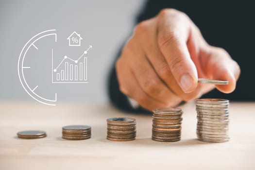 Property investment's essence, Hand stacks money coins under house icon. Insure valued asset, guarantee rent. Invest smart, embrace property's financial and tax potentials. insurance