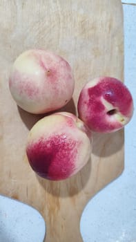 fresh peaches fruit food on kitchen board, dessert. High quality photo