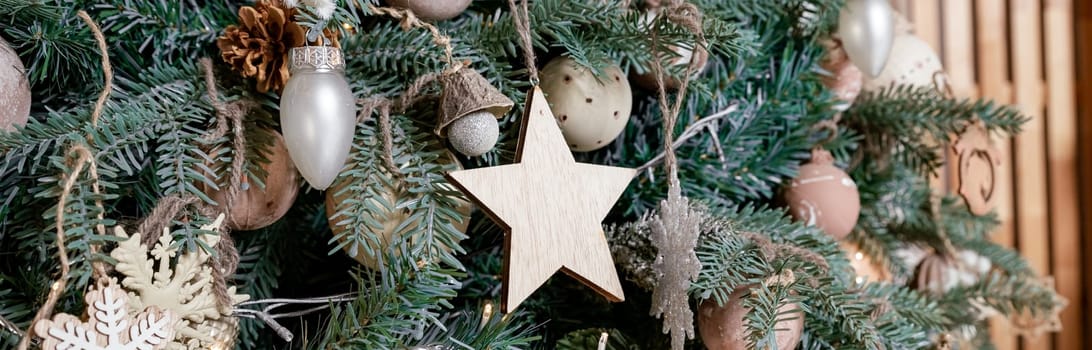 Diy honeycomb paper christmas ornaments hanging from Christmas tree by a window