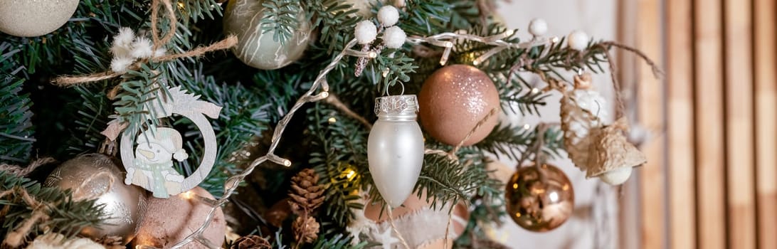 Diy honeycomb paper christmas ornaments hanging from Christmas tree by a window