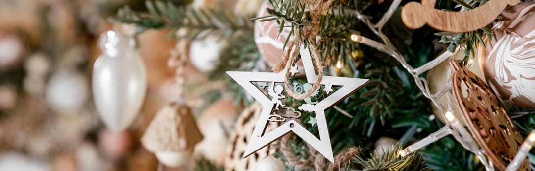 Diy honeycomb paper christmas ornaments hanging from Christmas tree by a window