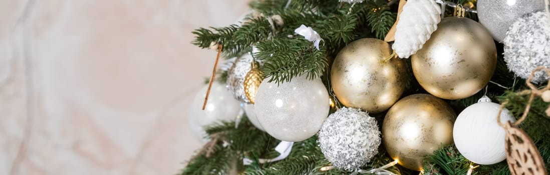 Magic glowing tree. Christmas home interior with Christmas tree. Red and white balls hanging on pine branches.