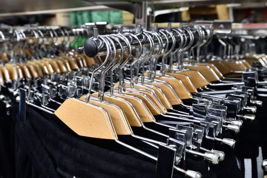 Black trousers on hanger in a store