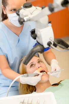 Young woman having dental surgery in stomatology clinic teeth checkup
