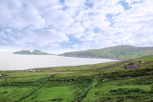scenic view in kerry ireland of fields coastline and islands