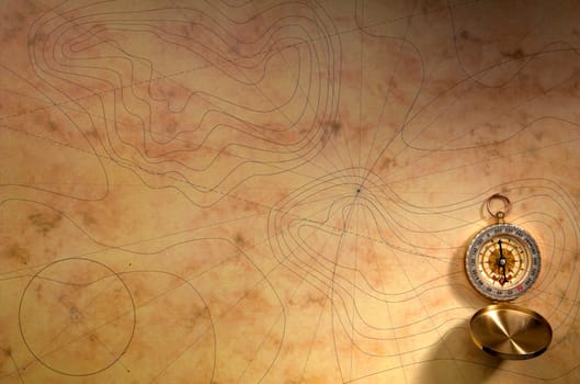 Close up view of the Compass on the old paper background
