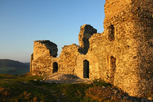 Ruins of old castle in the light of the sunset (Europe)