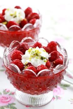 Strawberry dessert with raspberries and cream