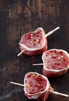 Raw Sirloin steak of pork wrapped in bacon