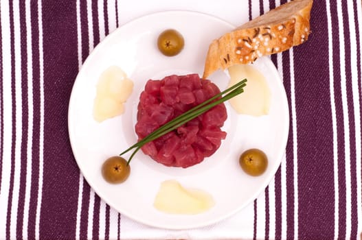 Tuna tartare with chives and olives and ginger