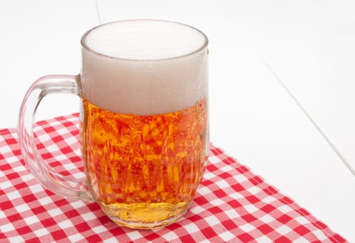 Glass of Beer on Red Gingham Tablecloth
