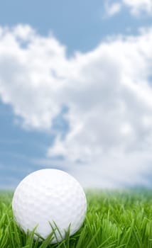 Golf Ball in Grass and Blue Sky