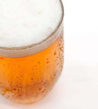 Closeup of Glass of Draught Beer on White Background - Shallow Depth of Field