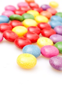 Round Candies in Many Colors on White Background