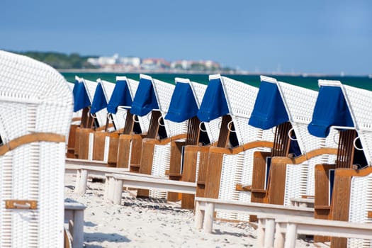 Beach chairs in a row on the Baltic Sea beach