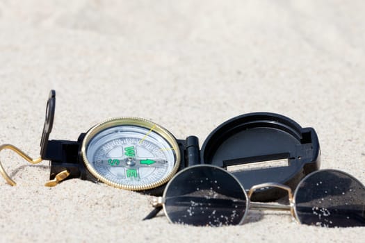 With the compass on a treasure hunt in the desert
