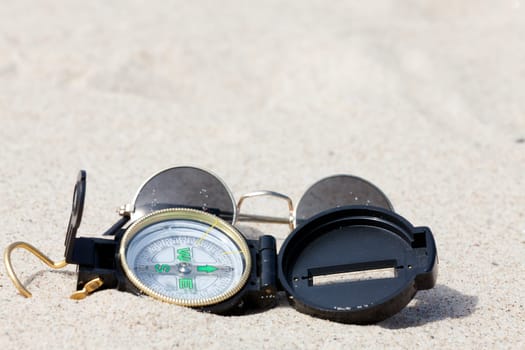 With the compass on a treasure hunt in the desert