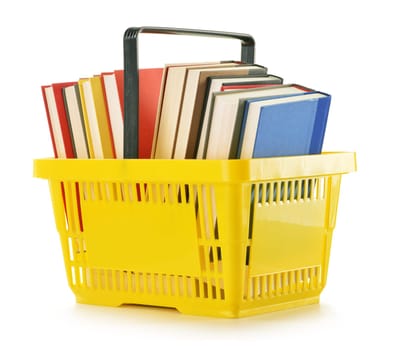 Plastic shopping basket with books isolated on white