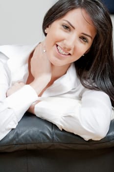 Young woman lying on sofa at home
