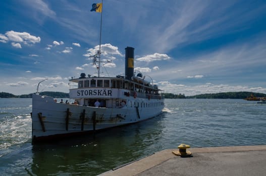 Old tourist ship Storskär approaching Vaxholm harbour in the Stockholm archipelago, Sweden
