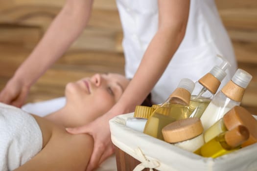 Beauty spa products in massage room woman enjoy treatment