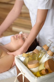 Beauty spa products in massage room woman enjoy treatment