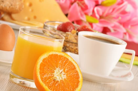 Breakfast on the table. Coffee, orange juice, rolls, muesli.