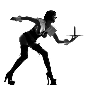 one sexy caucasian sexy woman  dress as a maid  with a dildo on a serving tray silhouette in studio isolated on white background