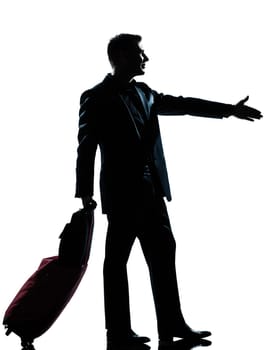 one caucasian man one caucasian business traveler man handshake  with suitcase  full length silhouette in studio isolated on white background