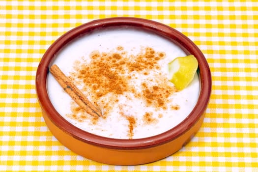 homemade rice with milk and cinnamon in a ceramic bowl