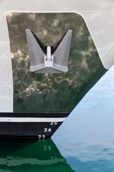 The anchor of a ship, nautical equipment. With details of the waterline.