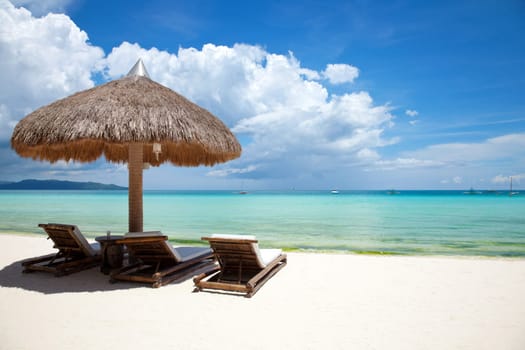 Deck chairs on a beautiful beach in Boracay, Philippines