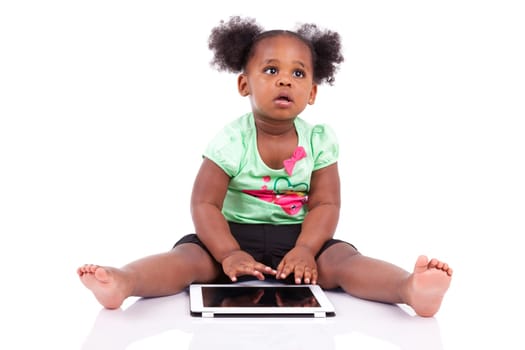 Little african american girl using a tablet  pc, isolated on white background