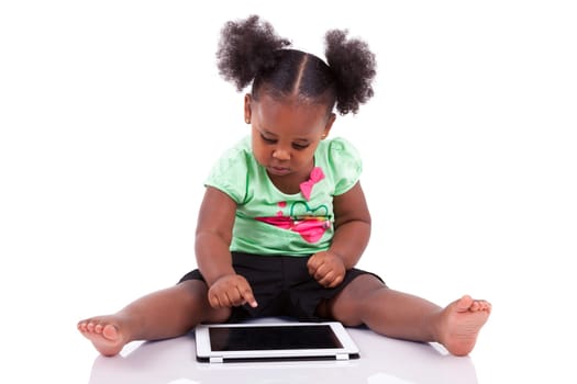 Little african american girl using a tablet  pc, isolated on white background