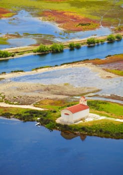 Small chapel in the wetlands of Prokopos Lagoon, Kalogria, Greece.