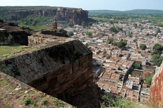 Aerial view of town with hilltop fort in the foreground at Badami, Karnataka, India, Asia