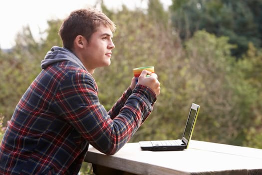 Young man with laptop computer