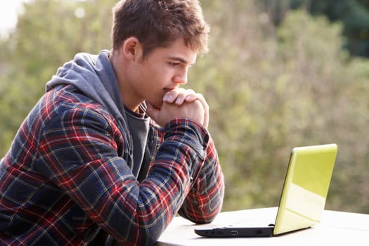 Young man with laptop computer