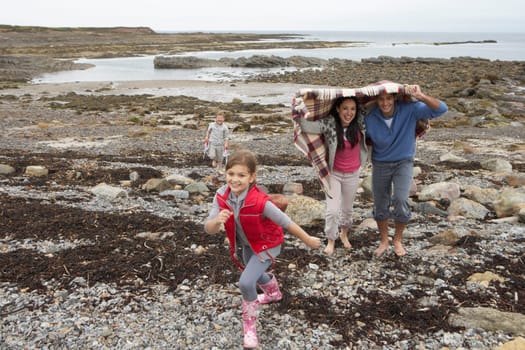 Family walking on beach
