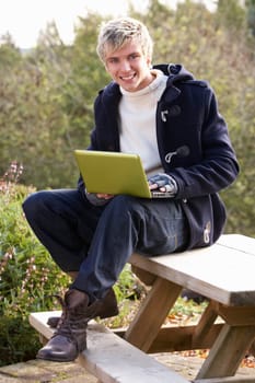Young man with laptop computer