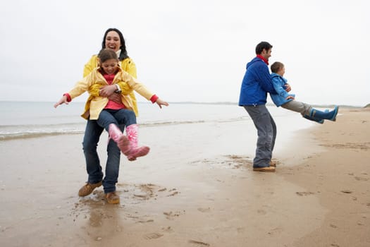 Family playing on beach