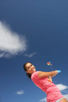 Teenage girl flying a kite