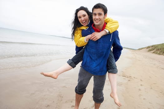Happy couple on beach in love