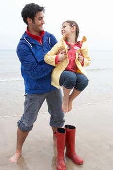 Father and daughter on beach