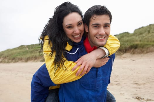 Happy couple on beach in love